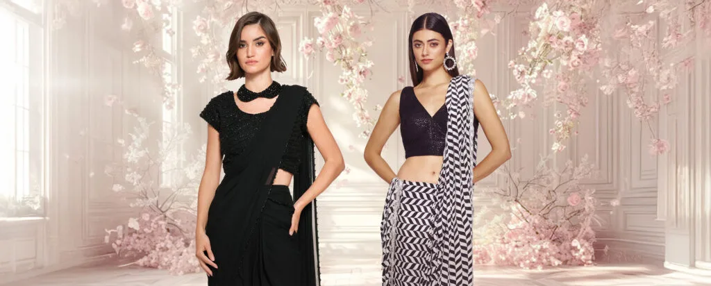 Minimalist sari in a solid neutral tone, paired with a sleek tailored blouse and understated jewelry.